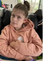 Annabelle, who lives with an STXBP1 disorder, smiling.