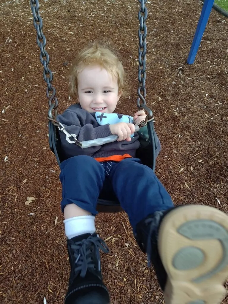 Austin, who lives with an STXBP1 disorder, smiling.
