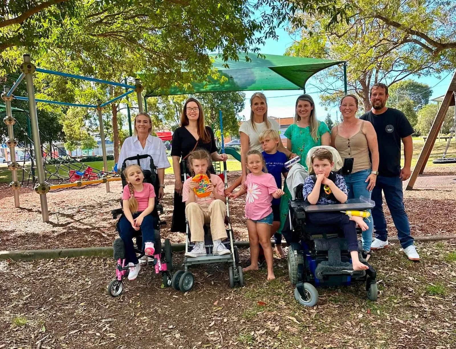 STXBP1 Australia parents and children, several in wheelchairs, together at a local playground.